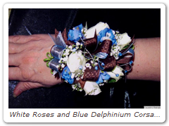 White Roses and Blue Delphinium Corsage